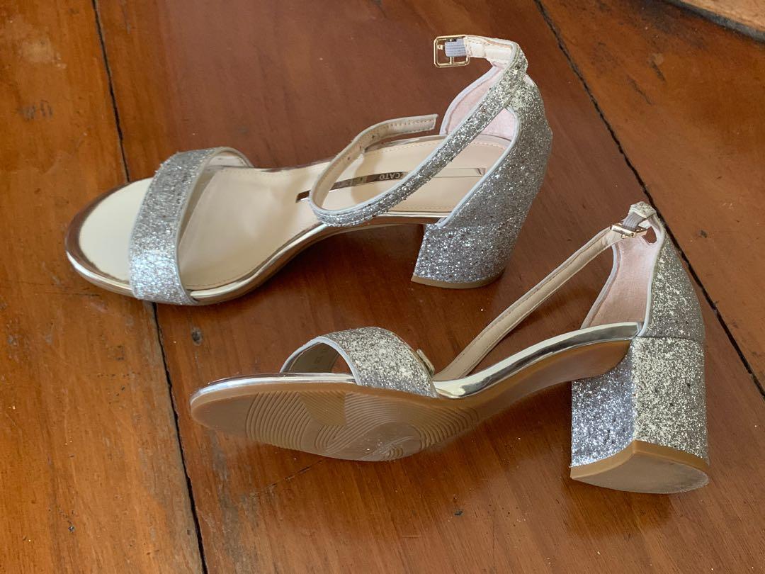 Staccato Silver Glitter Sandals (Category: Heels) located in Quezon City. Submitted by pingtbl (Listing ID 274307542, Image 2). Description: Bought in Hong Kong and used only once for a special occasion. Still in excellent condition. Actual size is US 6.5 / 23cm. Heel height is approx 6cm. Comes with 1 dust bag but no box..