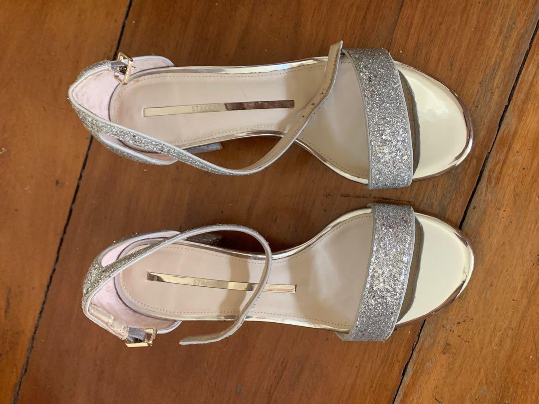 Staccato Silver Glitter Sandals (Category: Heels) located in Quezon City. Submitted by pingtbl (Listing ID 274307542, Image 3). Description: Bought in Hong Kong and used only once for a special occasion. Still in excellent condition. Actual size is US 6.5 / 23cm. Heel height is approx 6cm. Comes with 1 dust bag but no box..