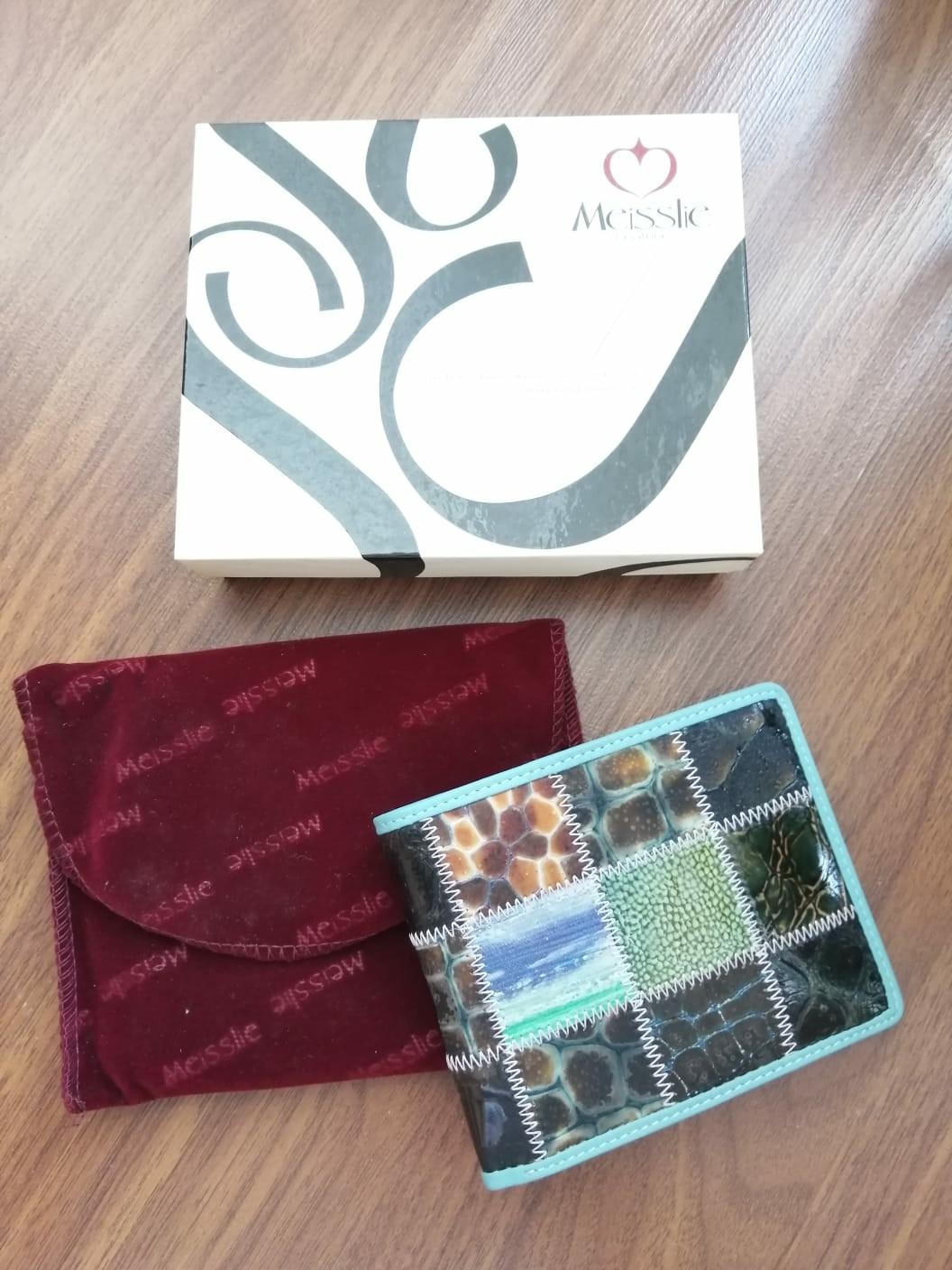 New Leather patchwork wallets (Category: Wallets & Card Holders) located in Singapore. Submitted by pally (Listing ID 274660831, Image 6). Description: Brand new quality leather wallets. Made from a patchwork of decorated leather. Very unique. New with original box, never used. 2 colours available, price is for one wallet..