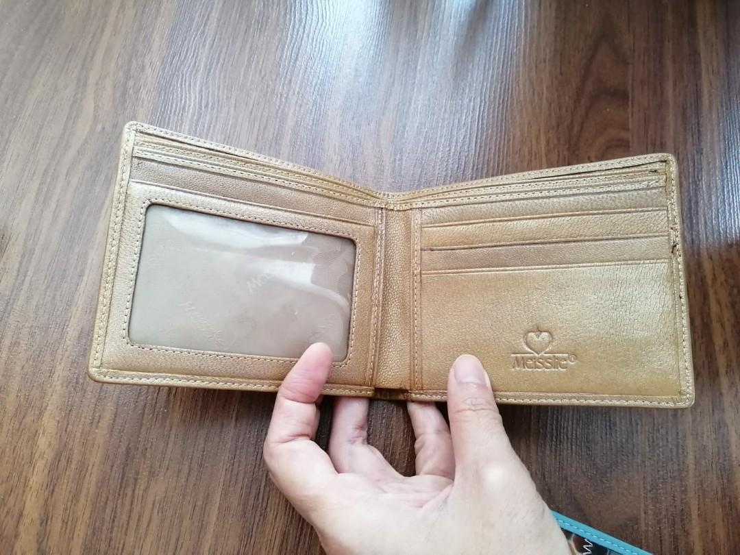 New Leather patchwork wallets (Category: Wallets & Card Holders) located in Singapore. Submitted by pally (Listing ID 274660831, Image 5). Description: Brand new quality leather wallets. Made from a patchwork of decorated leather. Very unique. New with original box, never used. 2 colours available, price is for one wallet..