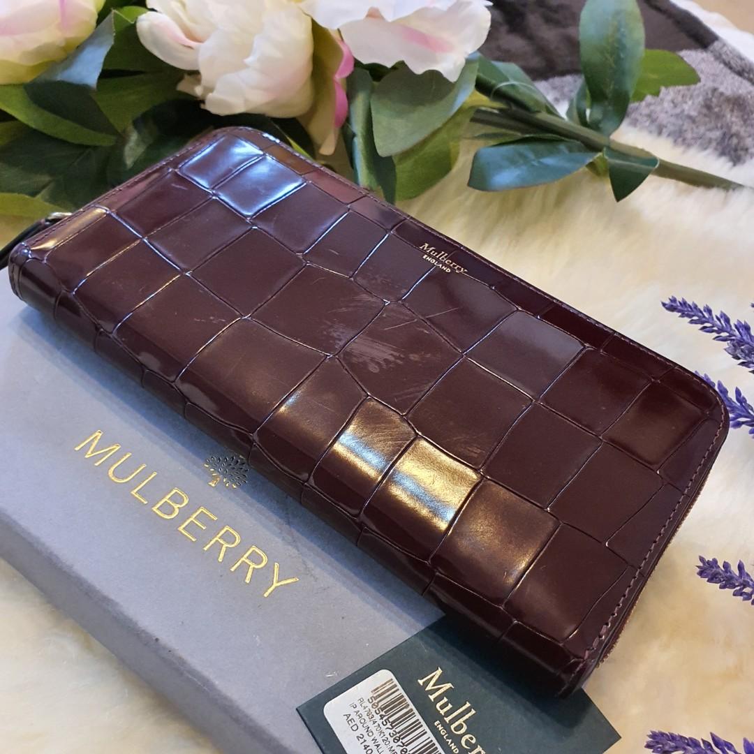 💯 Authentic MULBERRY Embossed Zip Around Wallet Burgundy (Category: Luxury Bags & Wallets) located in Quezon City. Submitted by chrizcboutique (Listing ID 274778959, Image 2). Description: This is an authentic MULBERRY Embossed Medium Zip with TAG and with price of AED2140 equivalent to SRP29,000++. This stylish wallet is crafted of luxuriously crocodile stamped leather in a deep burgundy. There is a zipper that opens to a matching leather inter