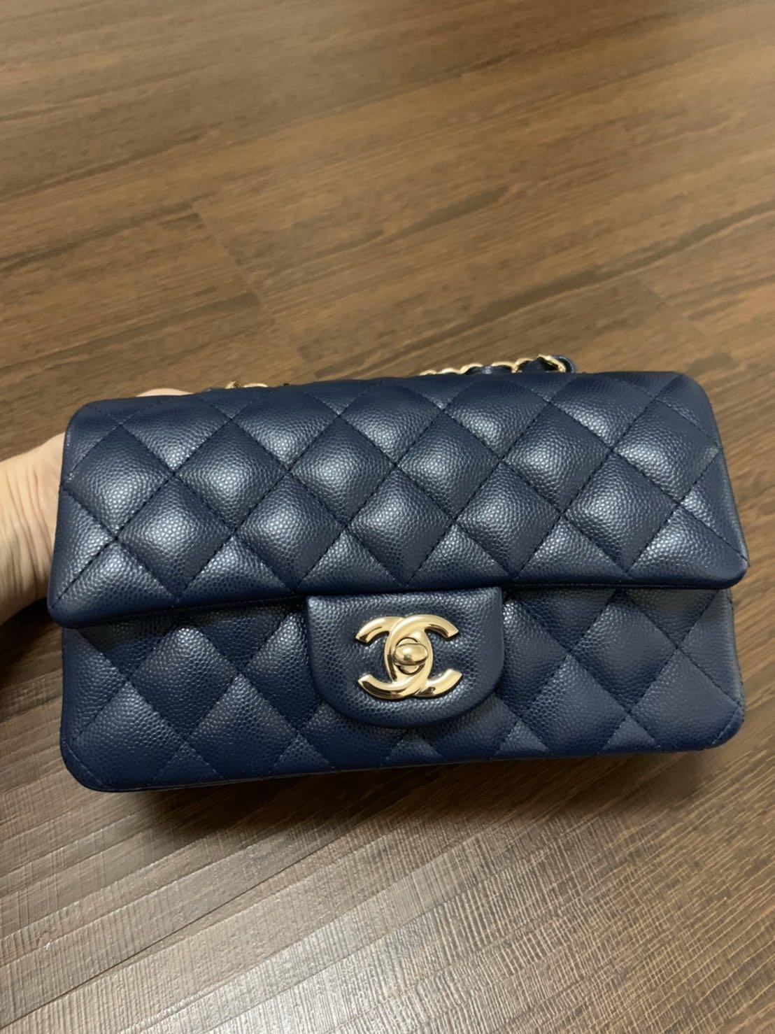 Sold Chanel mini rectangular navy blue caviar Sling Bag in ghw