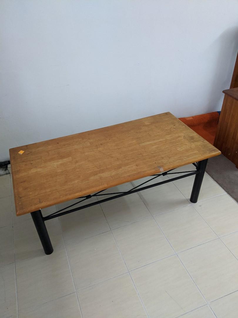 Coffee Table solid wood (Category: Tables & Sets) located in Kuala Lumpur. Submitted by CARLI108 (Listing ID 275090404, Image 2). Description: Sturdy old school coffee table. Solid wood top with black iron legs. Just superficial wood top could use stripping and revarnish. See photos Tall 45cm Deep 61cm Length 122cm.
