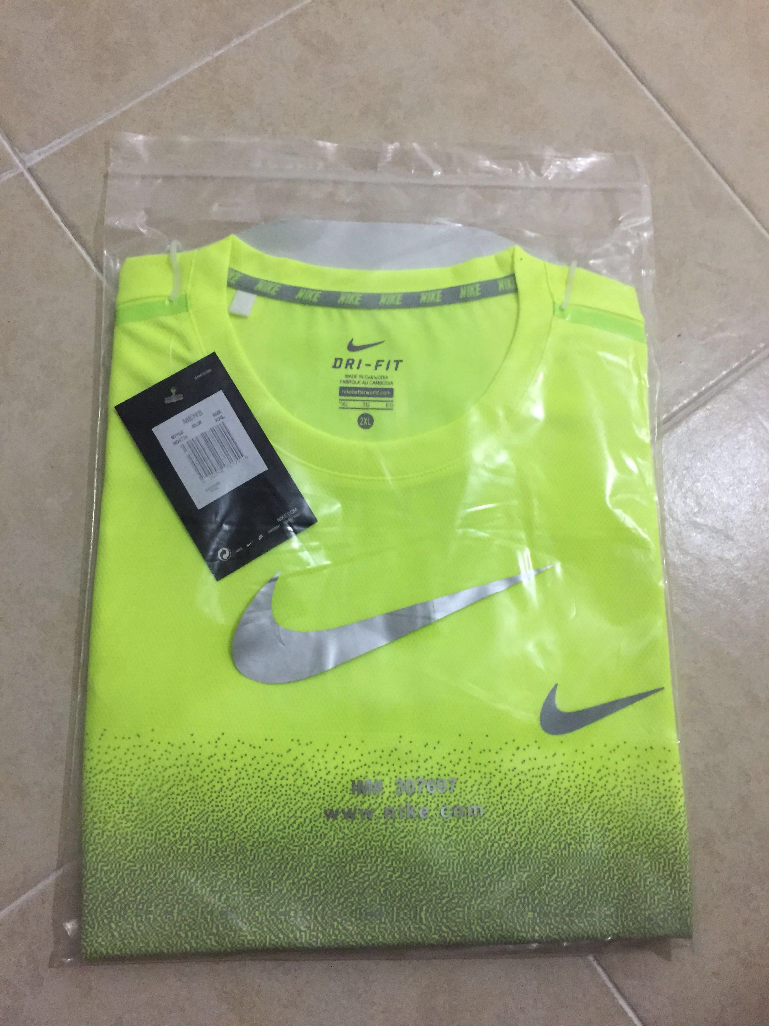 blue and lime green nike shirt 