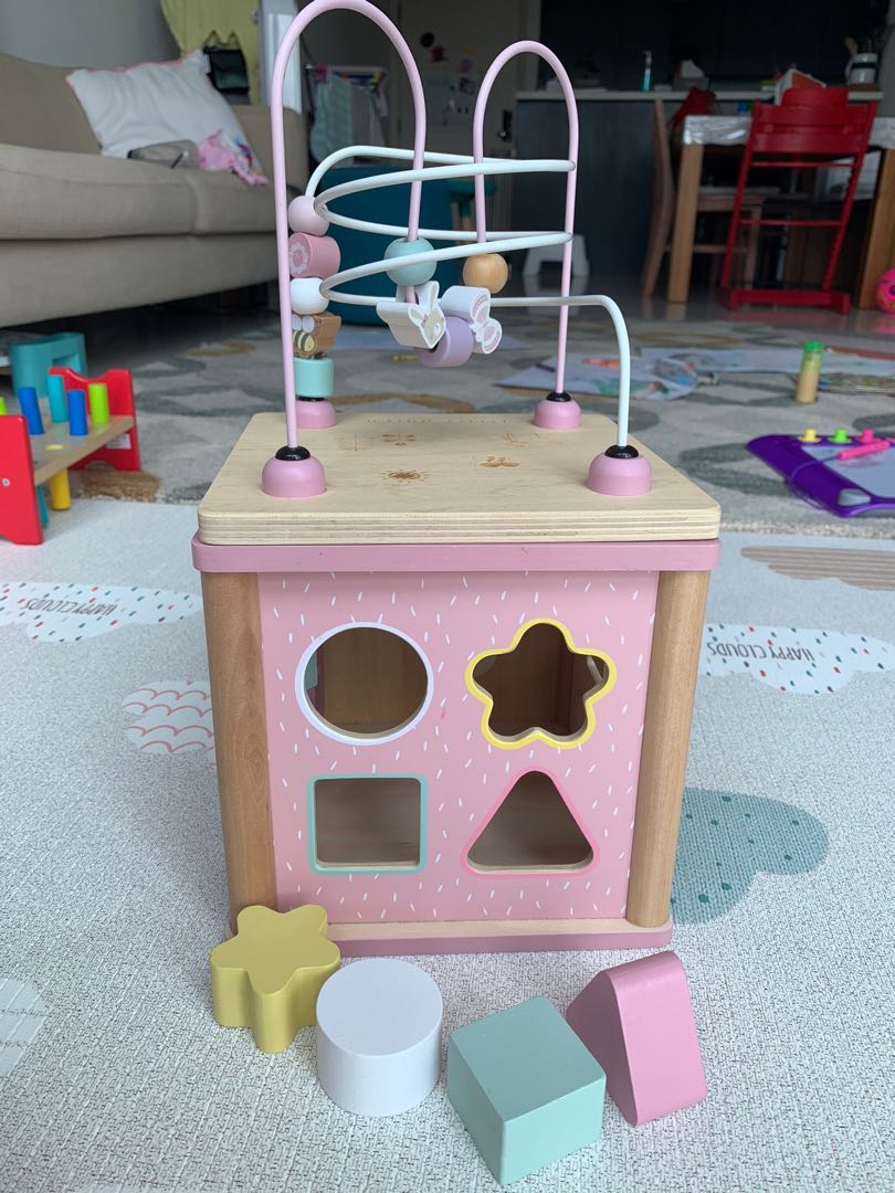 pink wooden activity cube