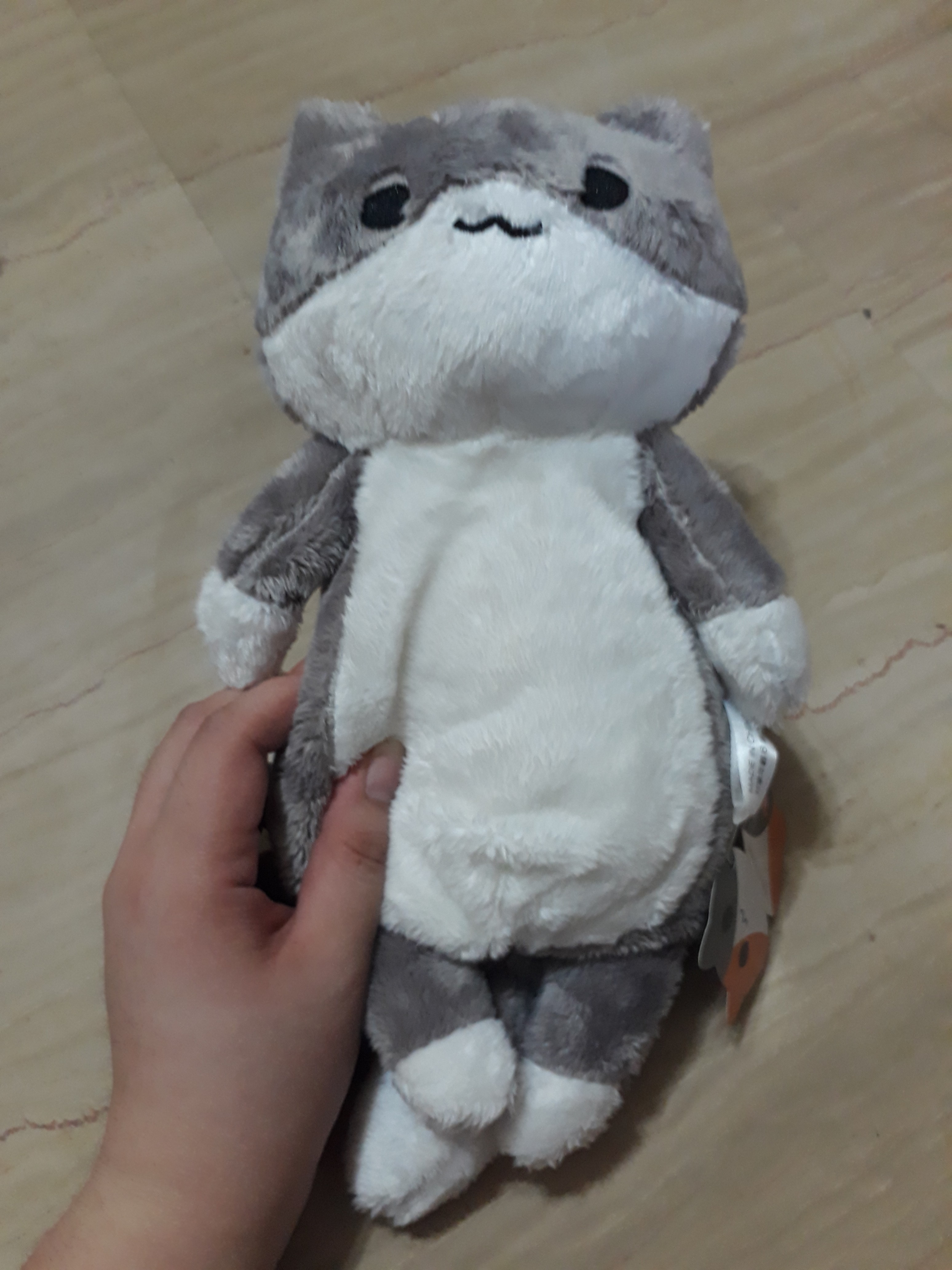grey and white plush cat