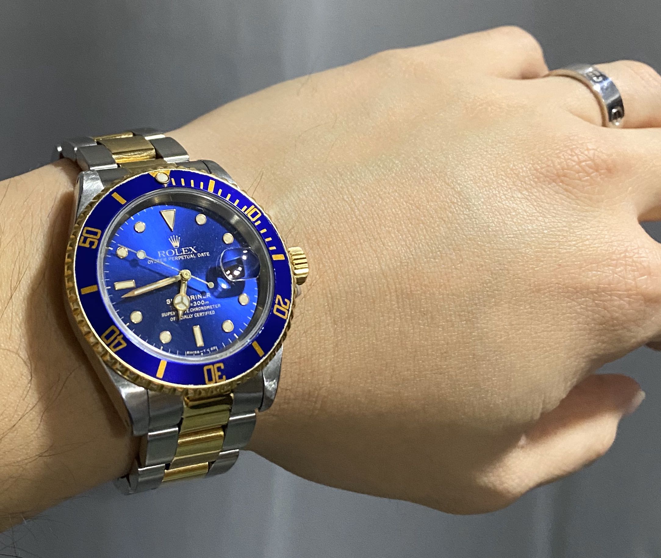 rolex submariner gold on wrist