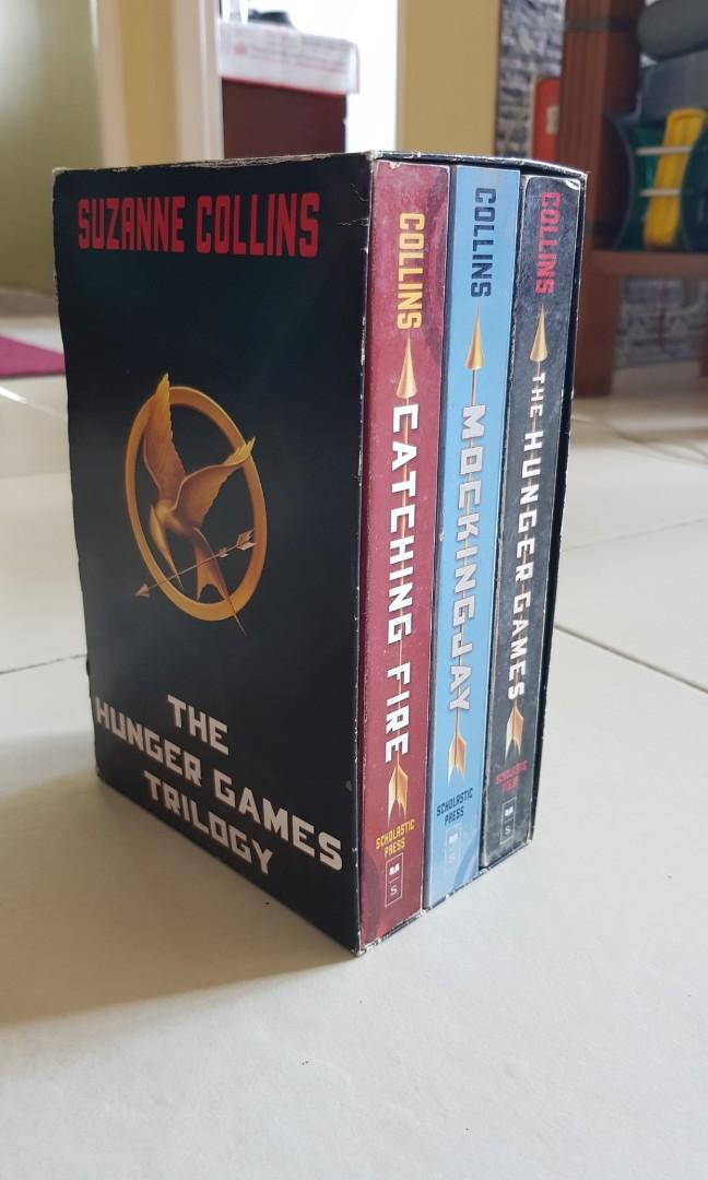 The Hunger Games Trilogy by Suzanne Collins (Category: Storybooks) located in Mandaluyong City. Submitted by fiogurt (Listing ID 275658803, Image 1). Description: Selling my pre-owned The Hunger Games book Trilogy by Suzanne Collins. Only read once, still in great condition. Pages are naturally yellowed with age. Includes cardboard box case. Message me if you're interested. May the odds be ever in your favor!.