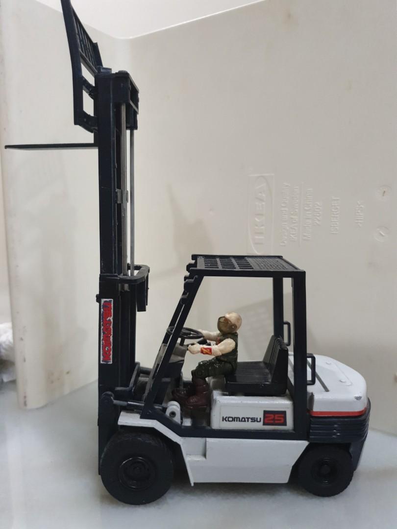Replica Komatsu forklift for display (Category: Vehicle & Diecast Models) located in Singapore. Submitted by poke_to_edge (Listing ID 275921315, Image 2). Description: a model of komatsu forklift with heavy metal parts at the back portion. real extendable mast. missing a fork as shown, can be replaced if you know DIY. nice scale. driver is a starcom figure not included. this is hard to find. What you see is what you get. De-cluttering, fast deal 