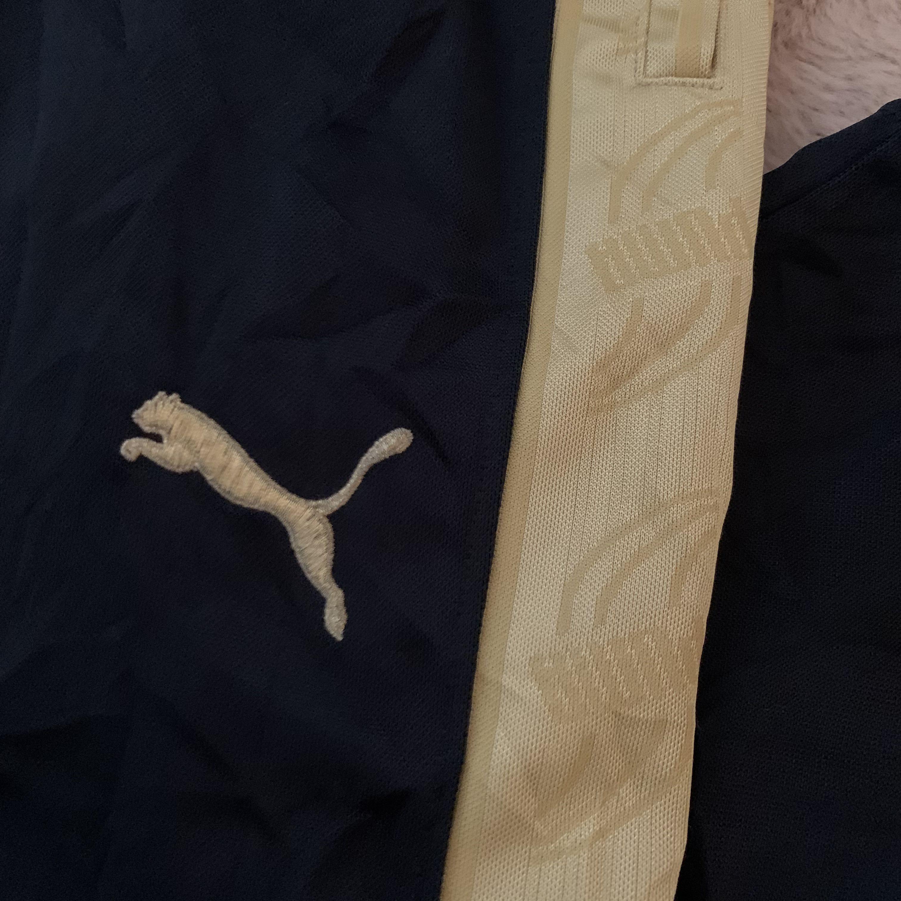 black and gold puma pants