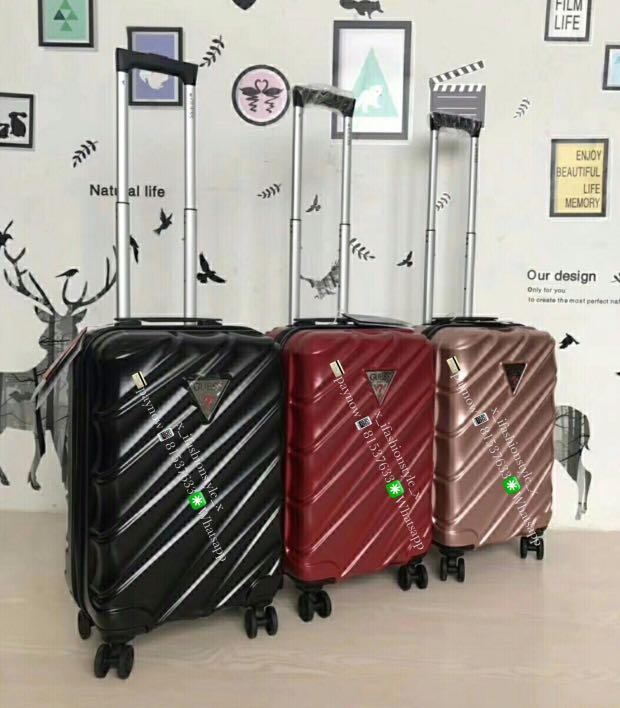 red guess suitcase