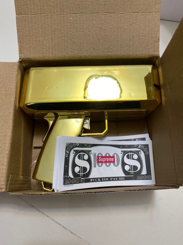 Golden supreme money gun, Hobbies & Toys, Toys & Games on Carousell
