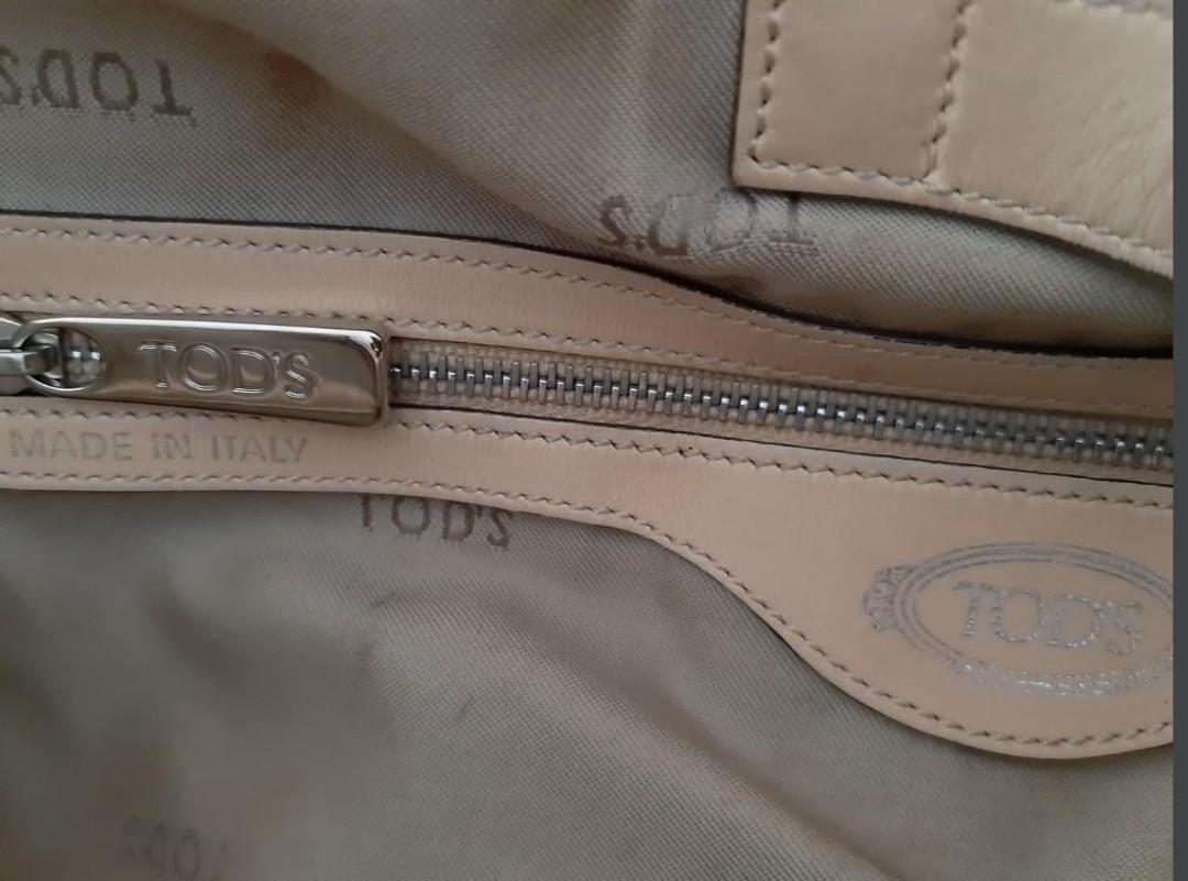 TOD'S (Category: Luxury Bags & Wallets) located in Quezon City. Submitted by mmamma.mi.a. (Listing ID 277007334, Image 3). Description: Tod's G tote bag In pretty yellow color and silver hardware Comes with dustbag and detachable straps Guaranteed authentic. Bought in US In good condition About 12 x 12 x 7 inches Made in Italy May be worn on hand, shoulder or cross body For shipping via lalamove or pick up only Payment via bpi transfer or upon pi