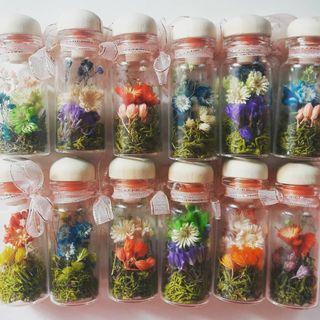 Dried flowers in glass vial