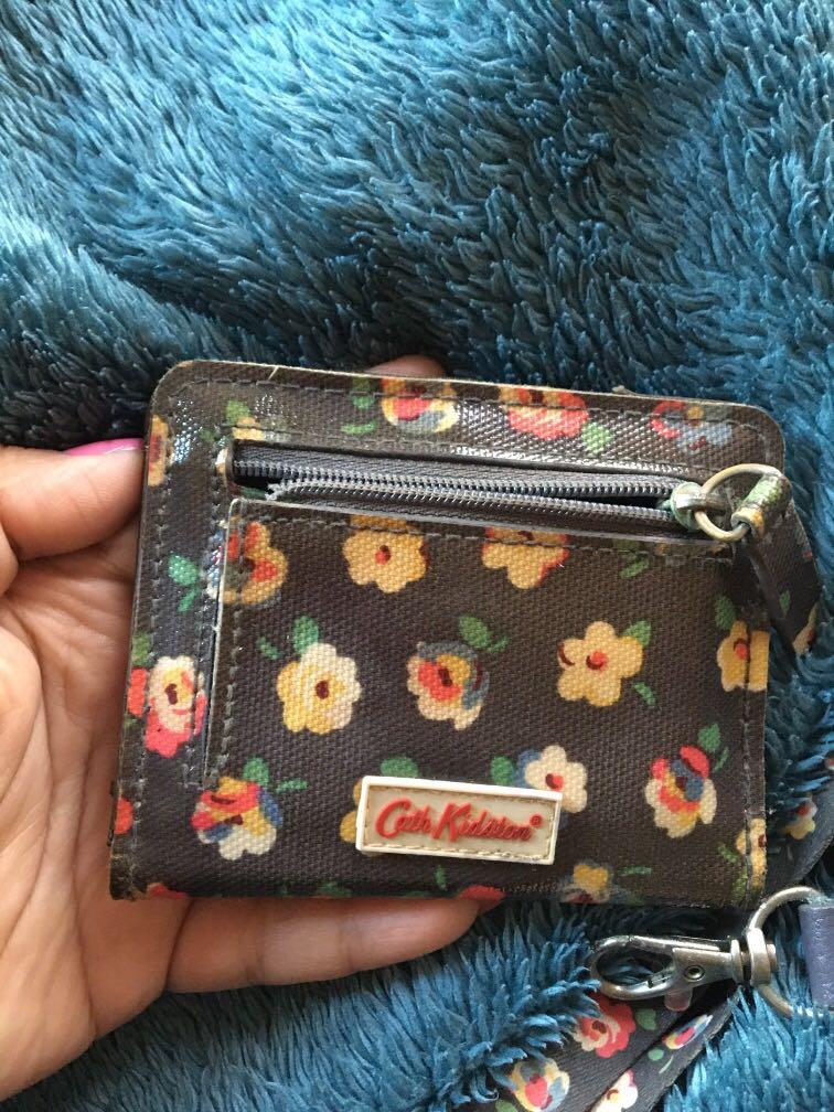 Cath Kidston mini wallet and ID lace (Category: Wallets & Card holders) located in Antipolo. Submitted by shopitsmeanttobe (Listing ID 277371325, Image 3). Description: Id lace and mini wallet flaw: yung mini wallet yung rubber glazing ung ibng side natanggal na maliban po doon ok nmn siya and yung sa lanyard as seen on photo ung circle na metal part mejo maitim na .