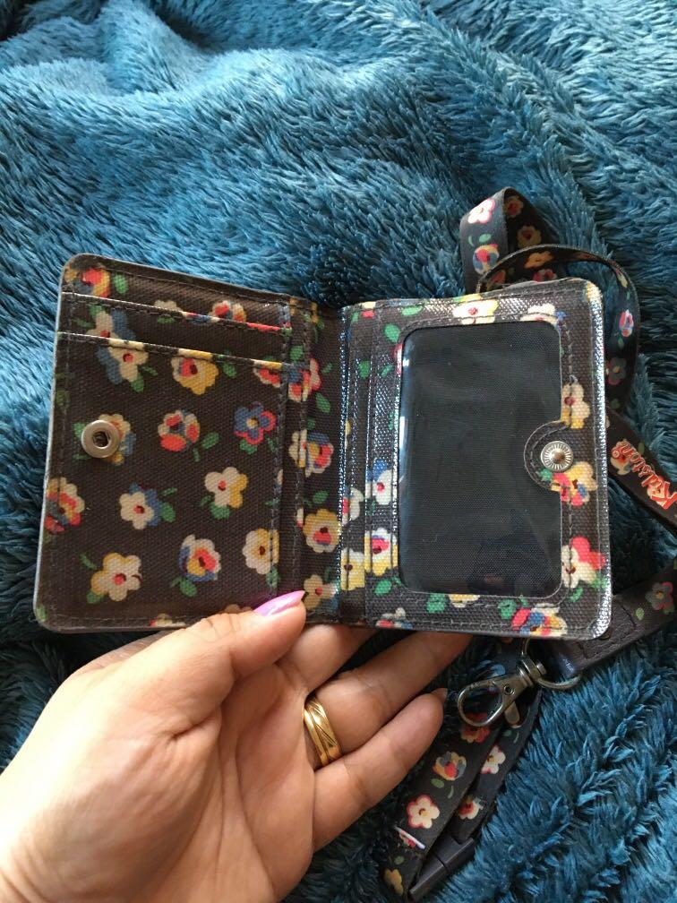 Cath Kidston mini wallet and ID lace (Category: Wallets & Card holders) located in Antipolo. Submitted by shopitsmeanttobe (Listing ID 277371325, Image 2). Description: Id lace and mini wallet flaw: yung mini wallet yung rubber glazing ung ibng side natanggal na maliban po doon ok nmn siya and yung sa lanyard as seen on photo ung circle na metal part mejo maitim na .
