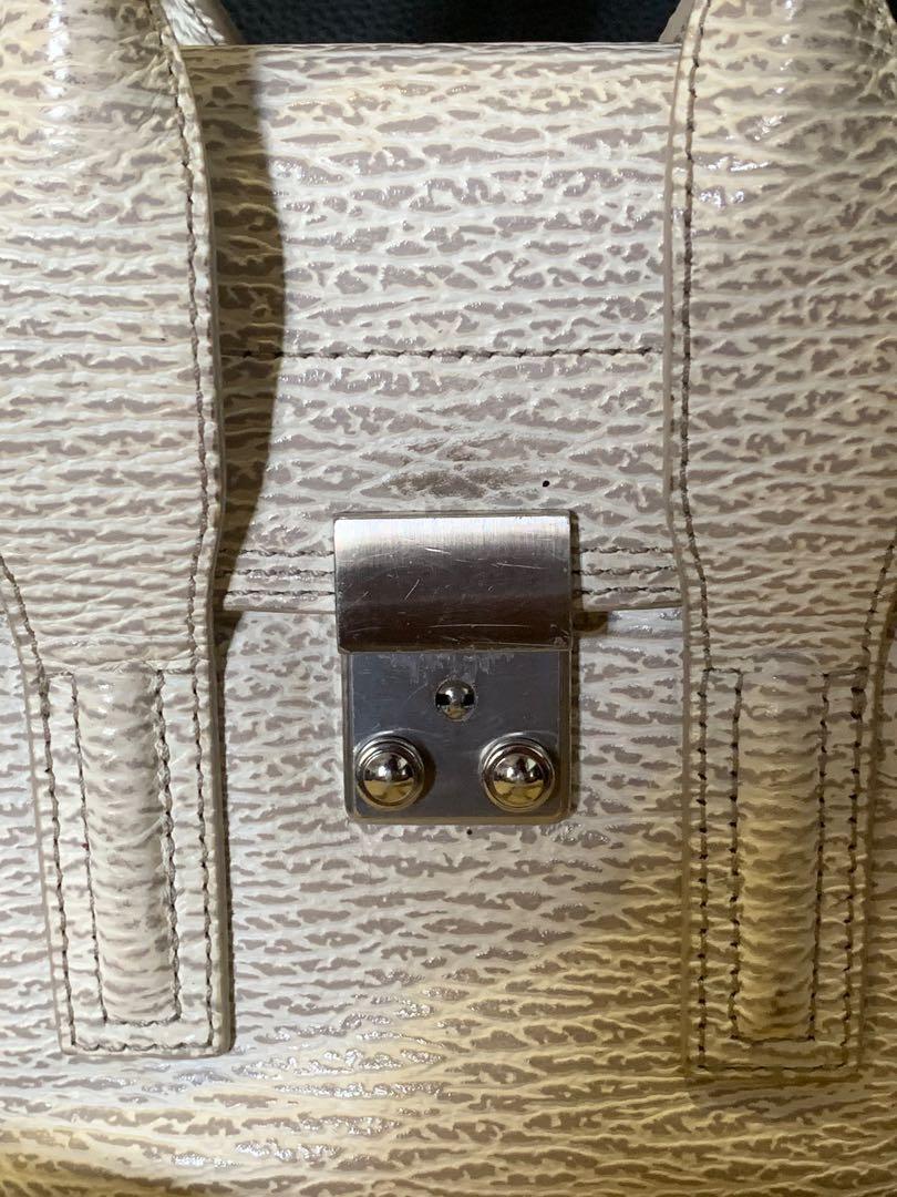 Philip Lim Pashli mini (Category: Luxury Bags & Wallets) located in Pasig City. Submitted by r.dizon (Listing ID 277366018, Image 3). Description: Ivory/Dove Shark Embossed Leather Mini Pashli Satchel Bag Silver Hardware This practical, yet elegant mini Pashli satchel bag will win your heart over with its irresistible style. Featuring grained leather, this shrunken down version of the Pashli bag has a long adjustable leather strap to be worn over