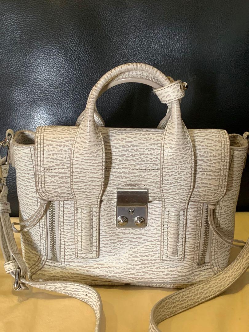 Philip Lim Pashli mini (Category: Luxury Bags & Wallets) located in Pasig City. Submitted by r.dizon (Listing ID 277366018, Image 1). Description: Ivory/Dove Shark Embossed Leather Mini Pashli Satchel Bag Silver Hardware This practical, yet elegant mini Pashli satchel bag will win your heart over with its irresistible style. Featuring grained leather, this shrunken down version of the Pashli bag has a long adjustable leather strap to be worn over