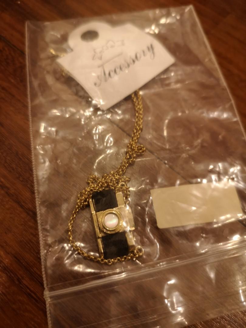 tiny camera necklace (Category: Necklaces) located in Singapore. Submitted by jumpandspin (Listing ID 277735726, Image 1). Description: bought never used..