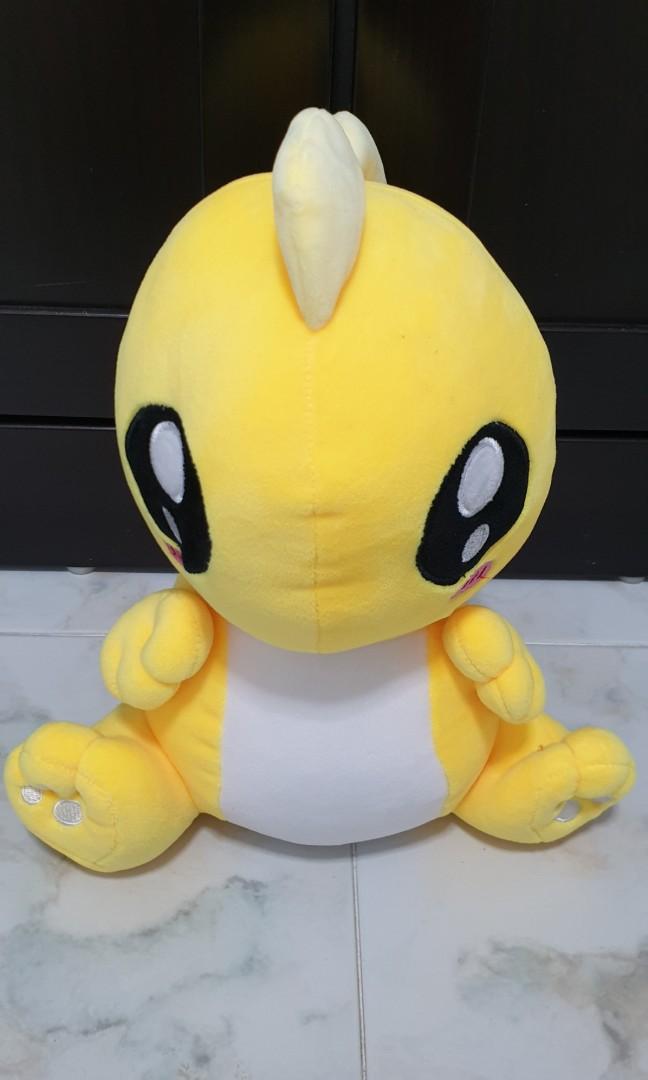 yellow stuffed dinosaur