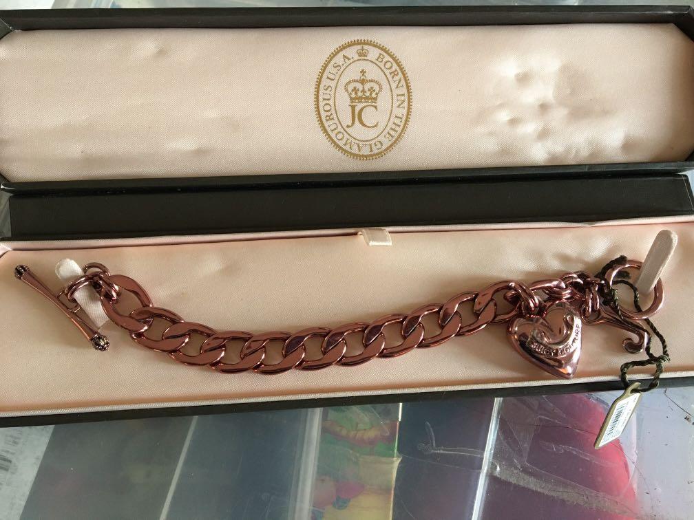 Juicy Couture bracelet (Category: Bracelets) located in Antipolo. Submitted by shopitsmeanttobe (Listing ID 278758234, Image 1). Description: Juicy couture pink bracelet flaw: ung pink na color nya some parts nag tarnish na pero di nmn halata kc mettalic pwede nyo din spary ng bagong color na gusto nyo :).