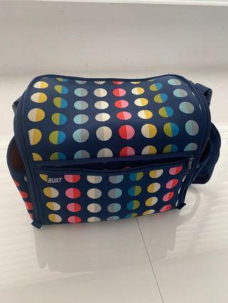 Built diaper bag with changing pad
