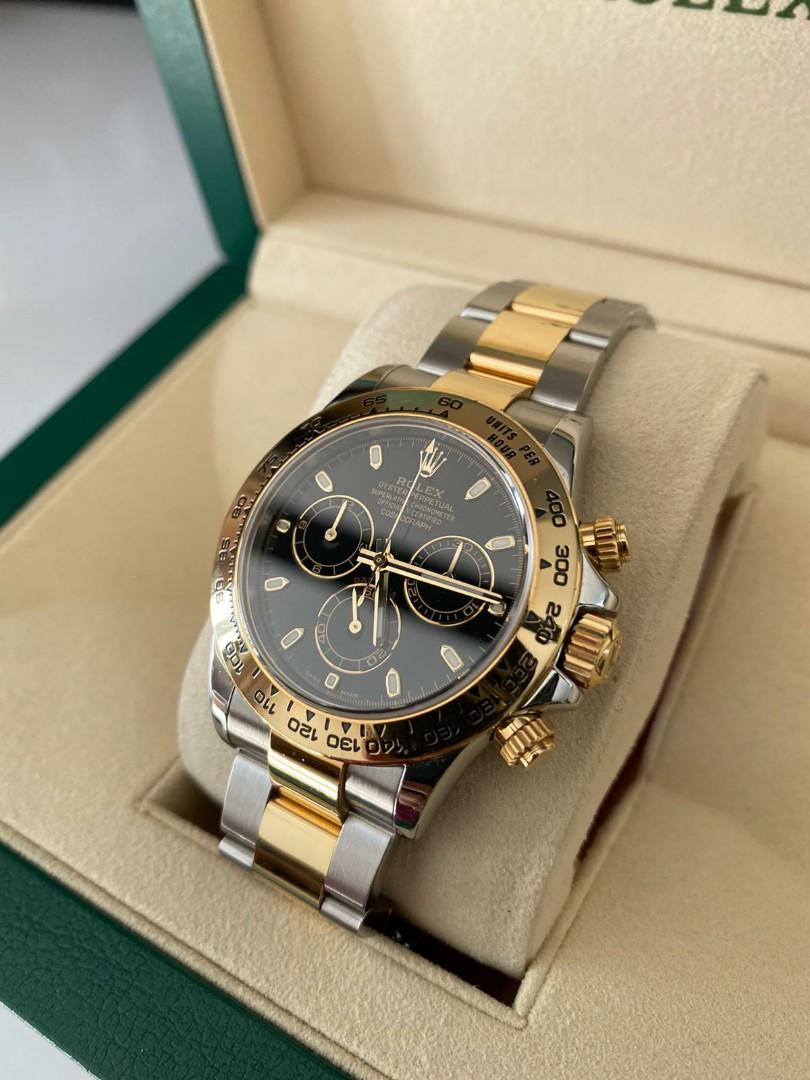Daytona half gold black dial top