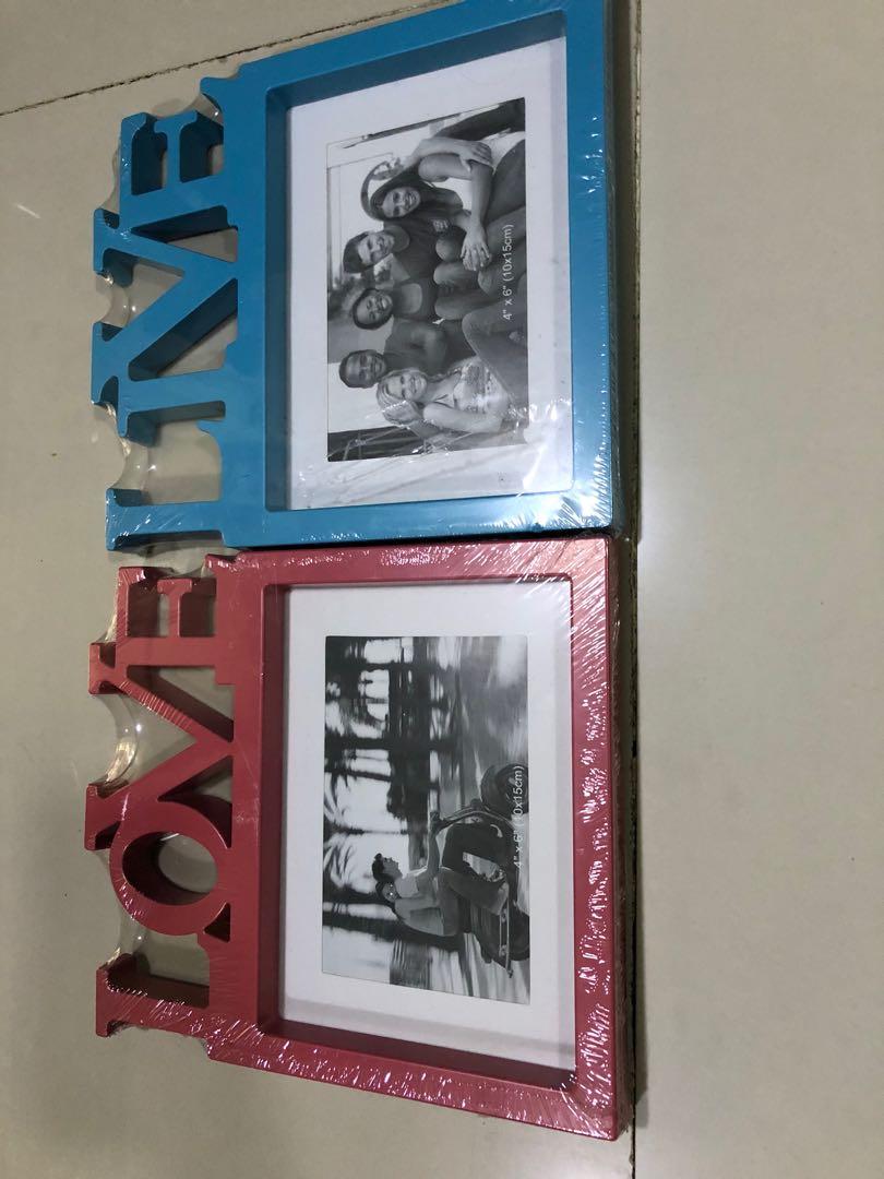 Love and Live picture frame (Category: Home Improvement Tools & Accessories) located in Makati City. Submitted by cbenj (Listing ID 280109074, Image 1). Description: 2 for 100.
