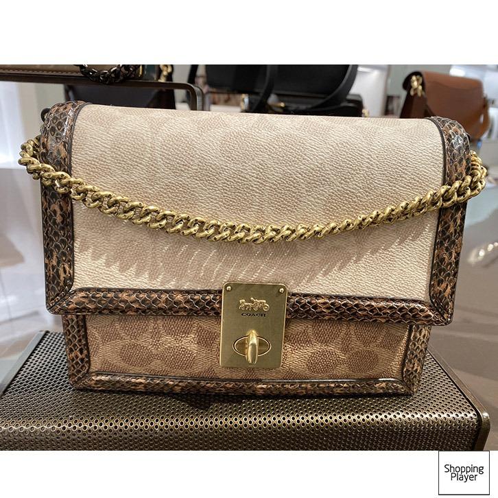 Hutton shoulder bag in blocked signature canvas with snakeskin detail top