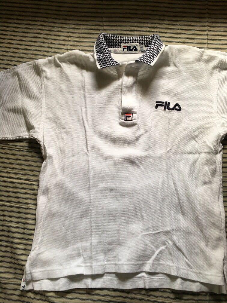 White polo shirt (Category: Shirts) located in Rizal. Submitted by tanielleee (Listing ID 280665307, Image 1). Description: Classic Fila polo shirt 9/10 Good conditon Size S-M Rfs: de cluttering.