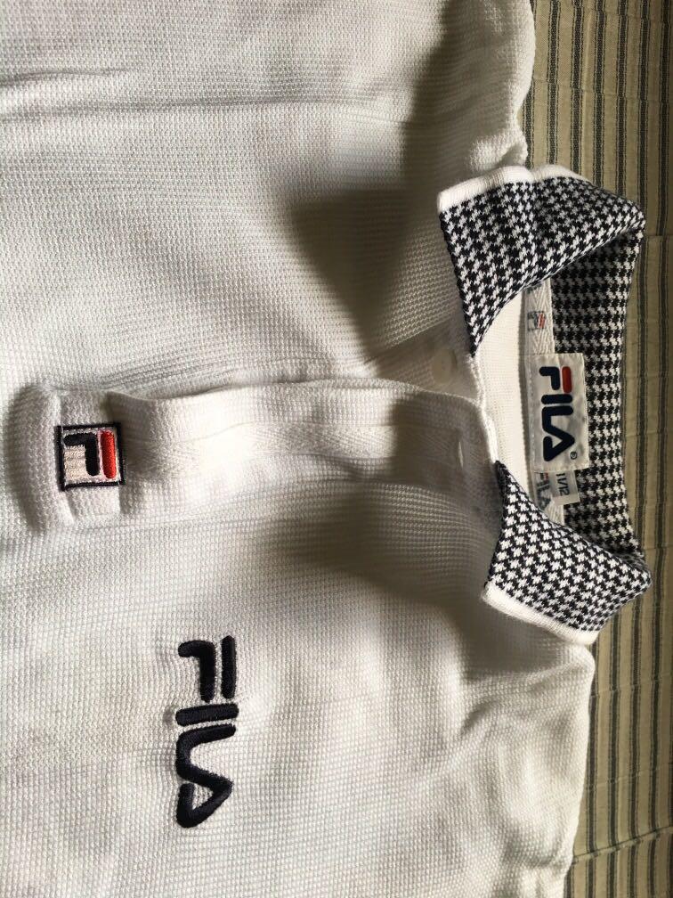 White polo shirt (Category: Shirts) located in Rizal. Submitted by tanielleee (Listing ID 280665307, Image 2). Description: Classic Fila polo shirt 9/10 Good conditon Size S-M Rfs: de cluttering.
