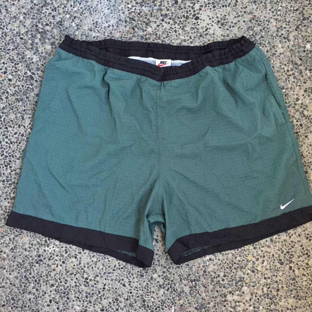 green nike shorts