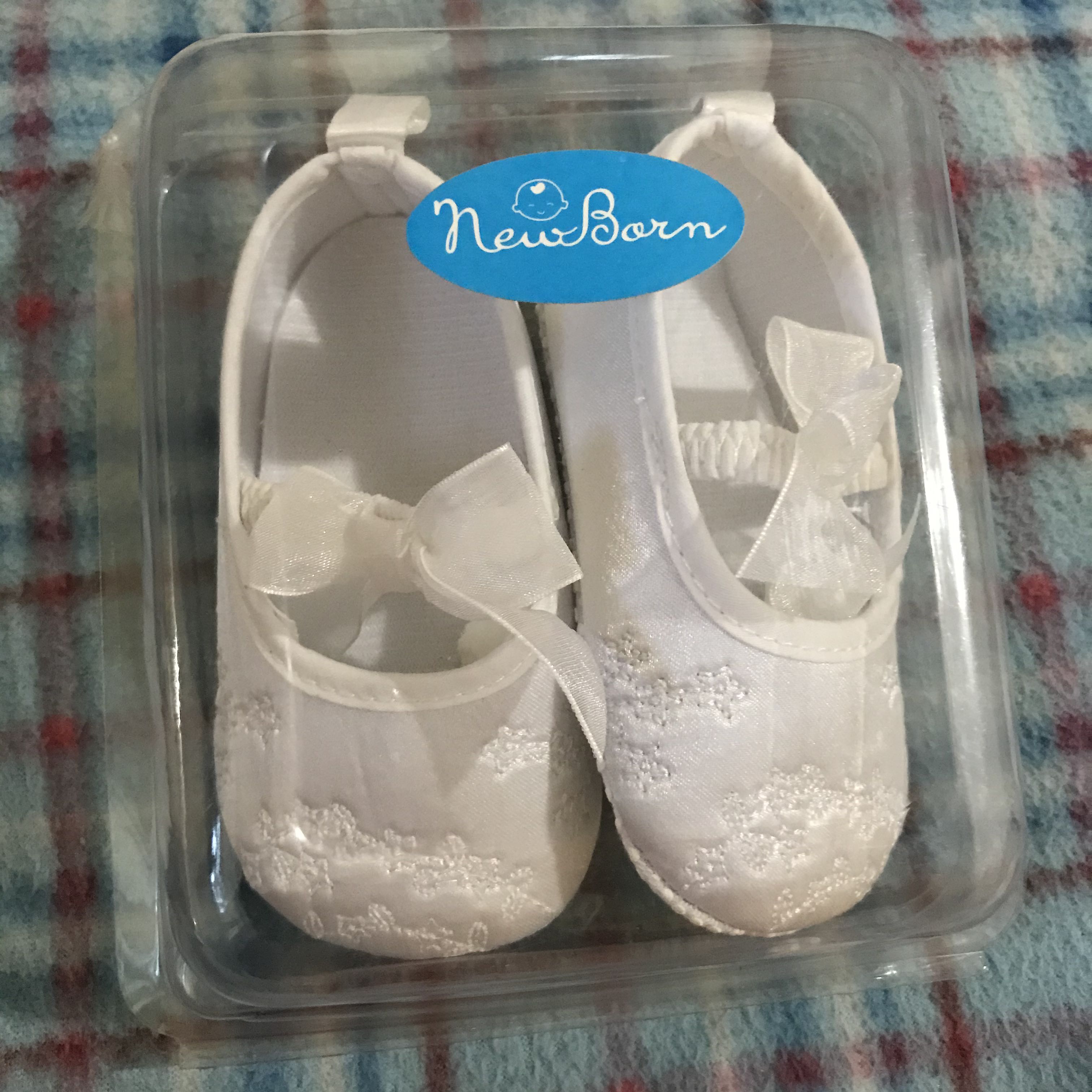 newborn white shoes girl