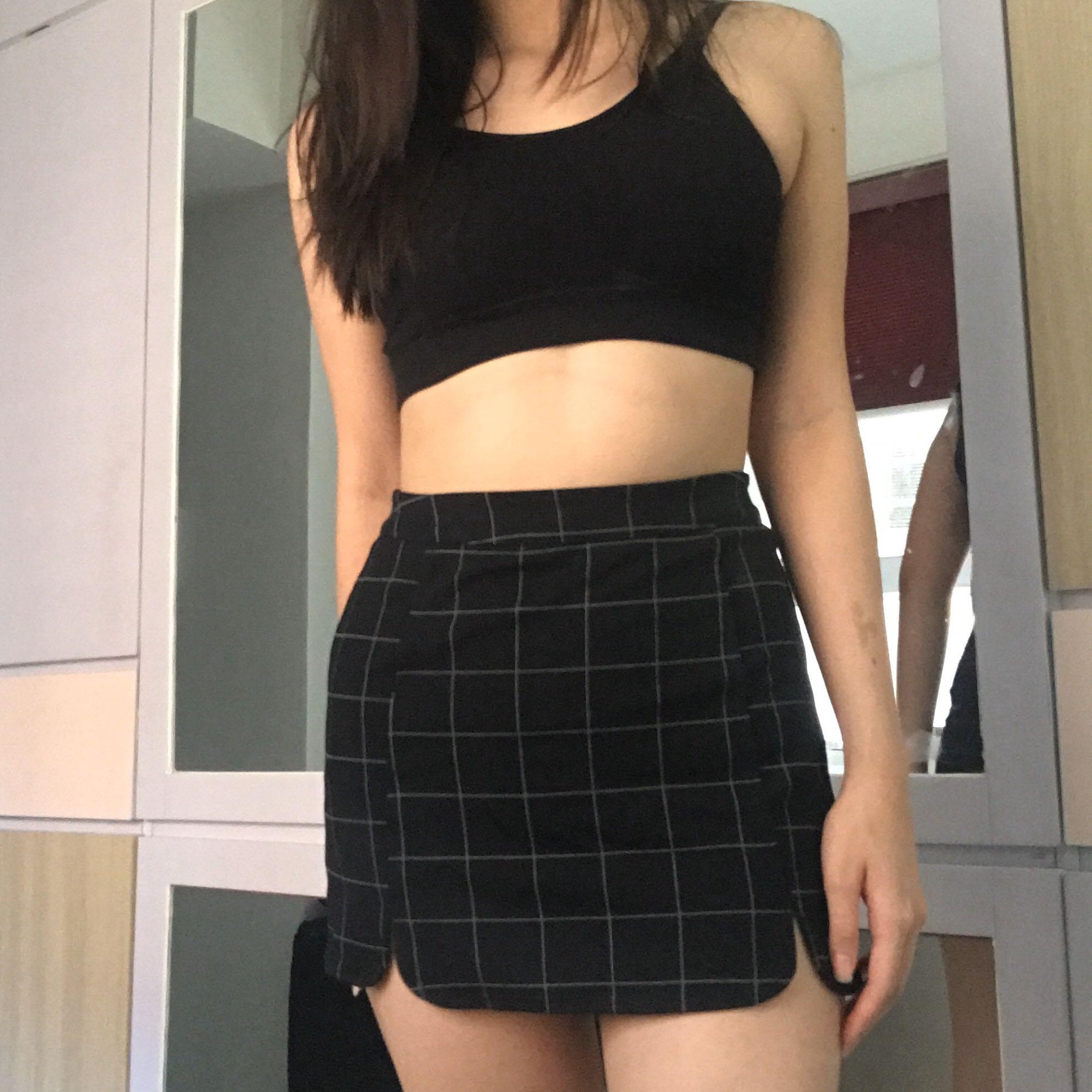 black skirt (Category: Skirts) located in Manila. Submitted by coconutbread (Listing ID 281261723, Image 2). Description: stretchy waist zipper enclosure at the back with 2 small slits in front measurements when laid flat: waist - 27 inches length - 13 inches recommended for petite figures model has a 26 inch waist.