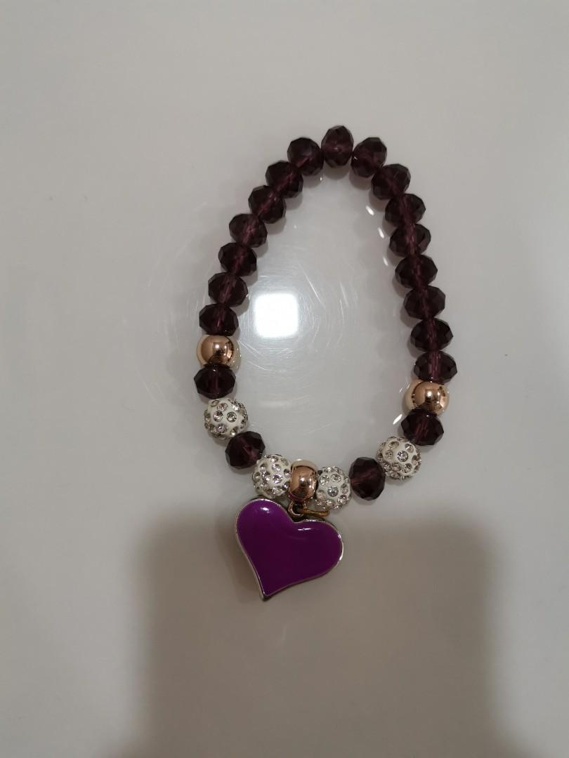 Assorted accessories (Category: Other Accessories) located in Singapore. Submitted by modestyinline (Listing ID 281483645, Image 7). Description: Assorted Bracelets & Rings 1 for $3 2 for $5 - Rose Gold Ring (Size 8) - Gold Ring (Size 7) - Blue Cat's Eye Bracelet - Black Beads with Girl Charm - Black Beads & Yellow Crystals with Heart Charm - Black Beads & Purple Crystals with Couple Heart Charm - Purple Crystal Bracelet with Heart Charm - Baby B