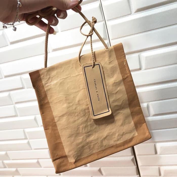 Paper bag clutch Charles and Keith