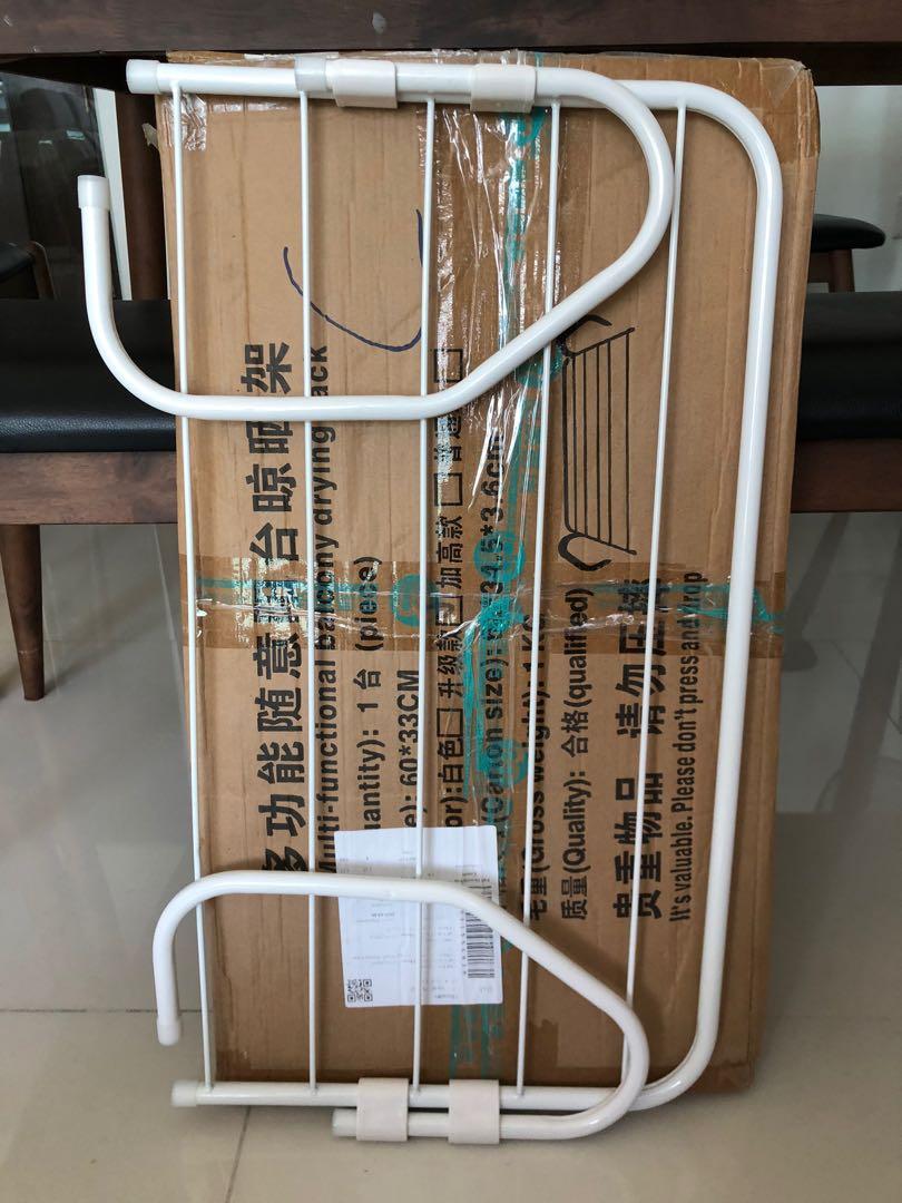 Drying Rack (Category: Bathroom & Kitchen Fixtures) located in Singapore. Submitted by happylivin (Listing ID 281736535, Image 2). Description: Balcony drying rack (new, opened js for photo taking) dimension 52x34.5x3.6cm space saving, good for hanging wet towels / shoes .