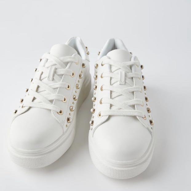 white and animal print trainers