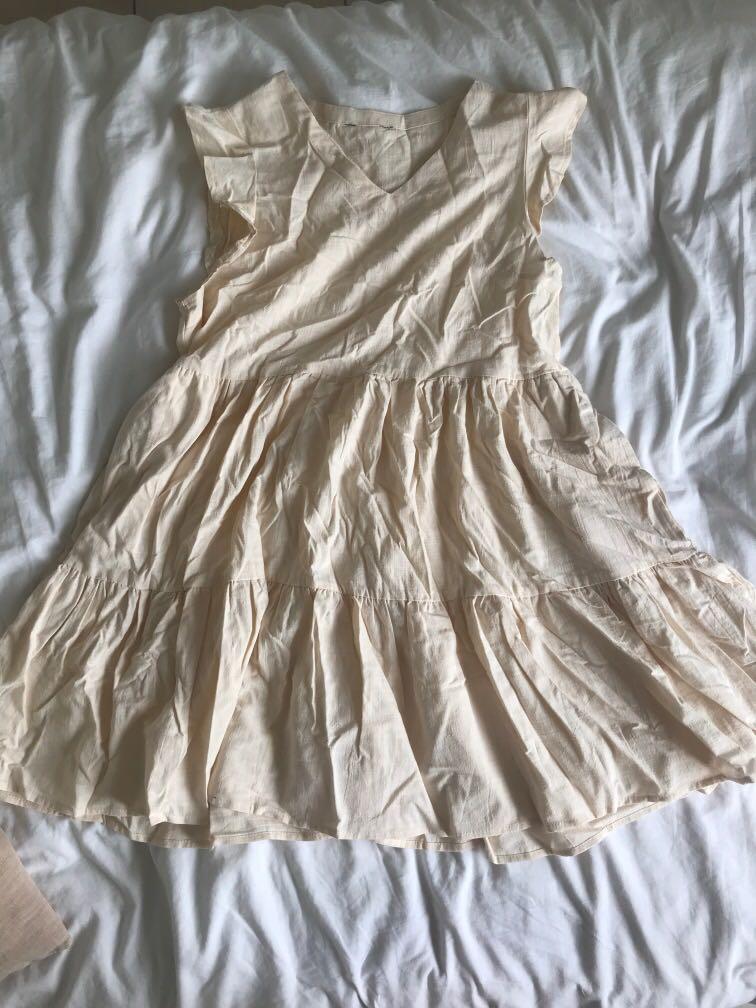 flowy cream dress with sleeves