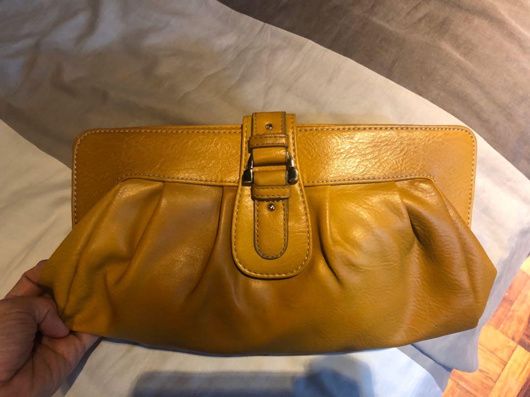 Liz Claiborne Yellow Clutch (Category: Clutches) located in Quezon City. Submitted by evecar_cf (Listing ID 282030935, Image 1). Description: Elegant Liz Claiborne mustard yellow leather clutch. Roomy enough to accommodate wallet, mobile phone, vanity kit, keys, etc. Perfect for casual wear, semi formal and formal wear. .