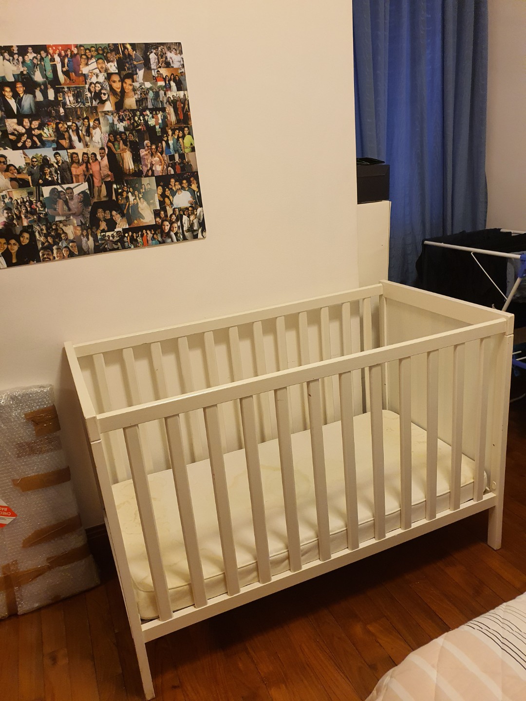white wooden baby cot