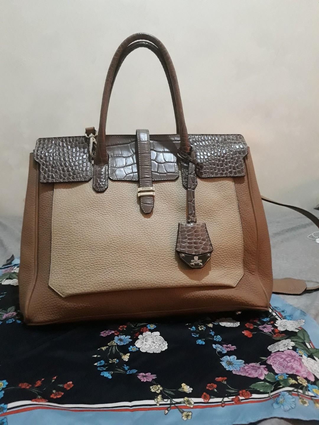 Authentic Bruno Magli bag (Category: Luxury Bags & Wallets) located in Quezon City. Submitted by dusty.cereal (Listing ID 282970090, Image 1). Description: Authentic Bruno Magli. In very good condition. Used only a few times and with utmost care. No issues. Genuine leather with removable straps. I just have to liquidate ASAP..