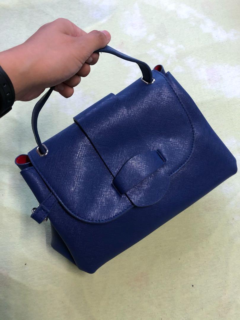 Blue Sling Bag (Category: Cross-body Bags) located in Manila. Submitted by toothless.project (Listing ID 283058912, Image 1). Description: Blue Sling with 2 Changeable Slings of your Choice. Prestine Condition, definitely not used. .