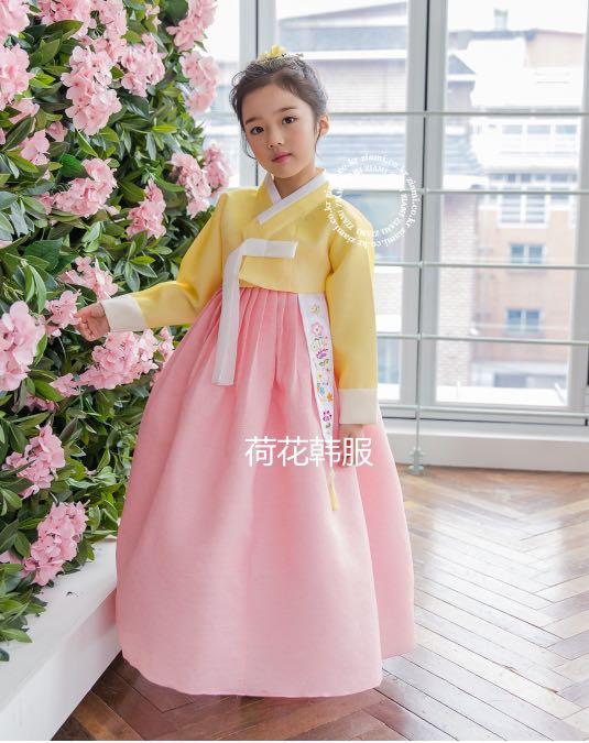 Hanbok, the traditional Korean dress and beautiful Asian girl with sakura  17738619 Stock Photo at Vecteezy