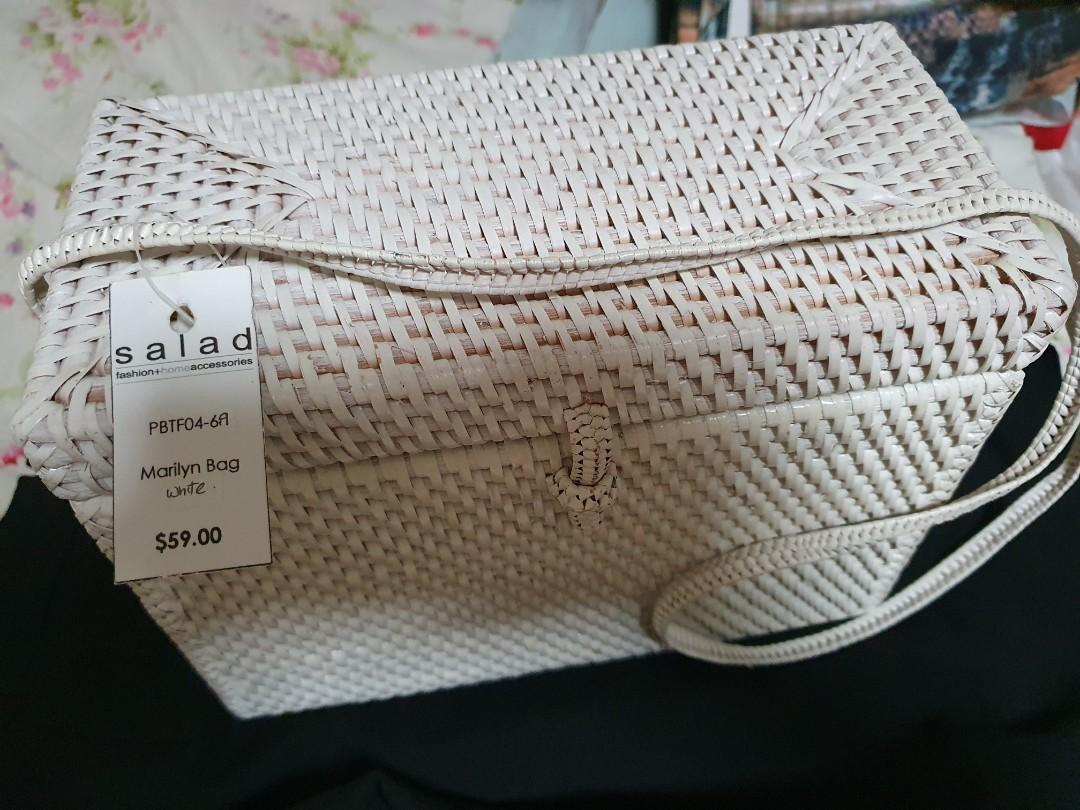 Straw bag with rectangular structure (Category: Tote Bags) located in Singapore. Submitted by aud_i_nary (Listing ID 283712266, Image 1). Description: Staw bag from the brand Salad (Haji Lane). Never found an occasion to use it. Has been in the dust bag all this while. Off-whitish colour. Very roomy and can fit a lot of your barang! Original price S$59. Pricetag is still intact. Price is negotiable. Front: 24cm x 19cm Top: 24cm x 12cm Side: 12cm 