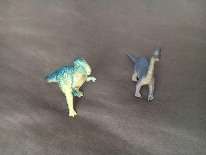 Figurines- two green and purple dinosaurs