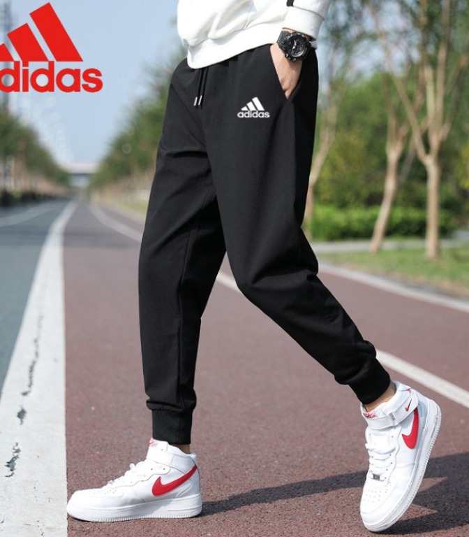 men in adidas pants