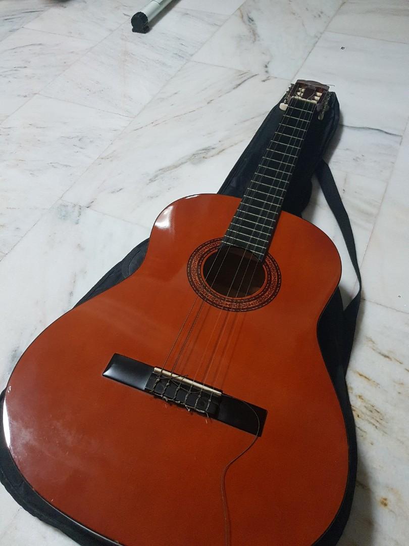 Classical Guitar (with replacement string) (Category: Musical Instruments) located in Singapore. Submitted by byanyname (Listing ID 284338913, Image 2). Description: Bought from Synwin, comes with guitar case. D string broke. Throwing in a pack of D'Addario Classic Nylon strings, you can change it on your own..