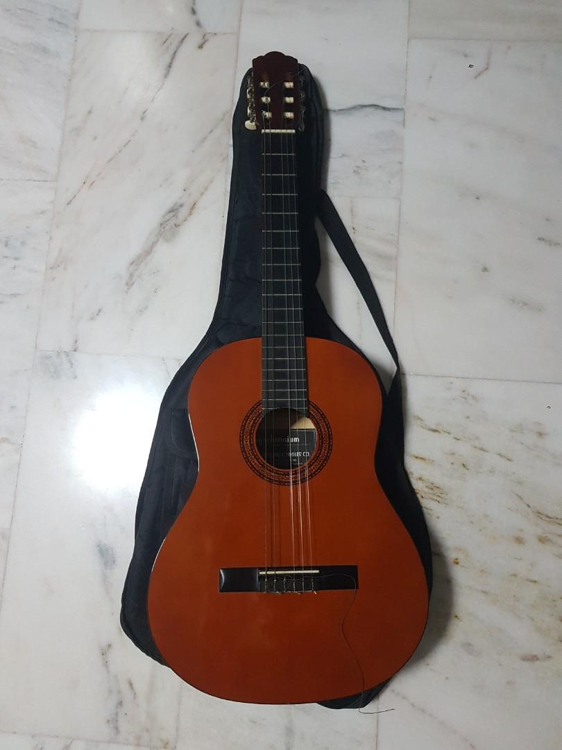 Classical Guitar (with replacement string) (Category: Musical Instruments) located in Singapore. Submitted by byanyname (Listing ID 284338913, Image 1). Description: Bought from Synwin, comes with guitar case. D string broke. Throwing in a pack of D'Addario Classic Nylon strings, you can change it on your own..
