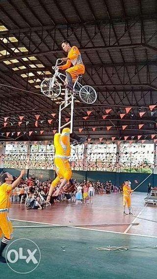 acrobats show with high wire walker and bicycle act